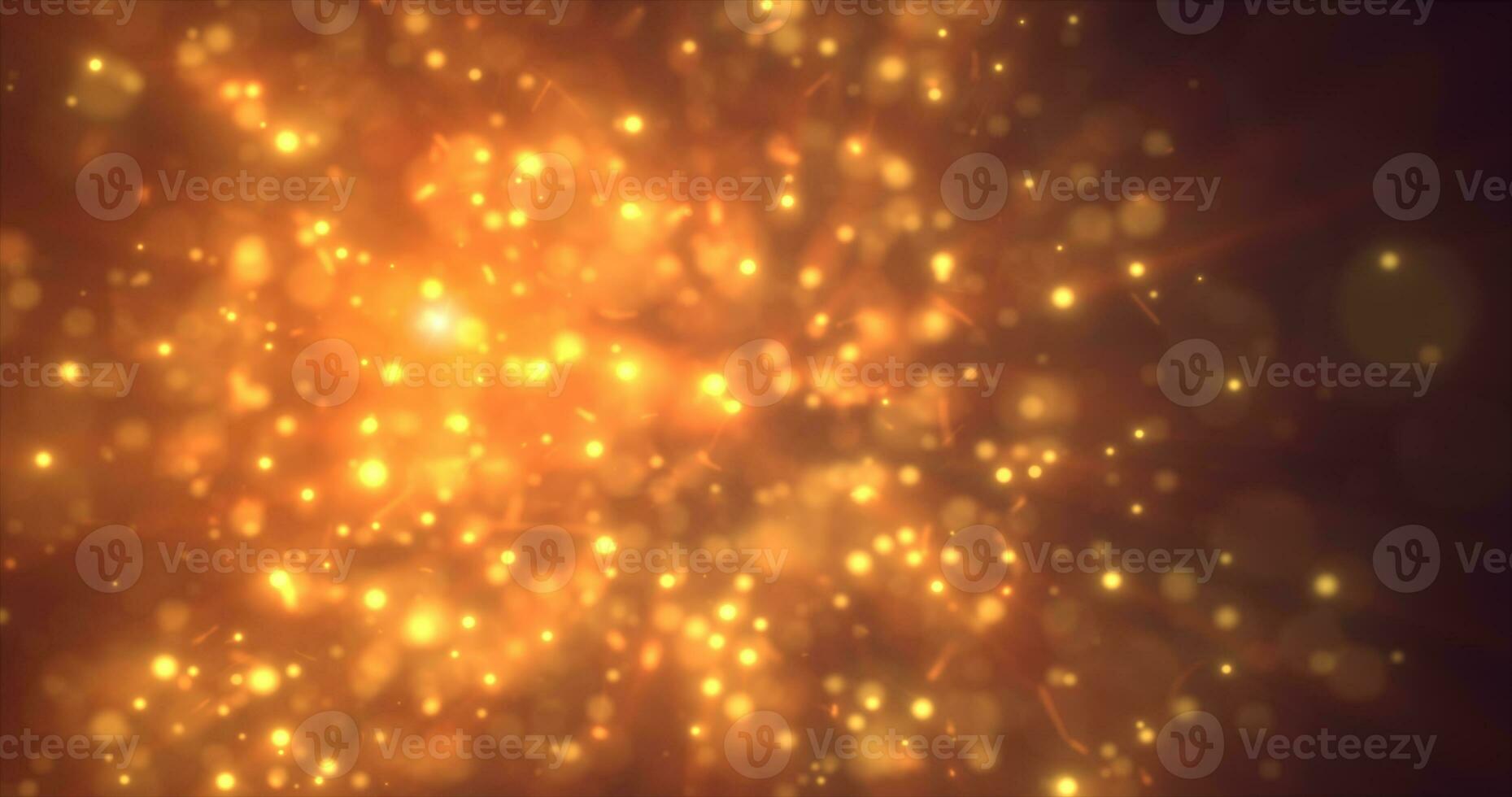 Abstract yellow orange energy particles and dots glowing flying sparks festive with bokeh effect and blur background photo