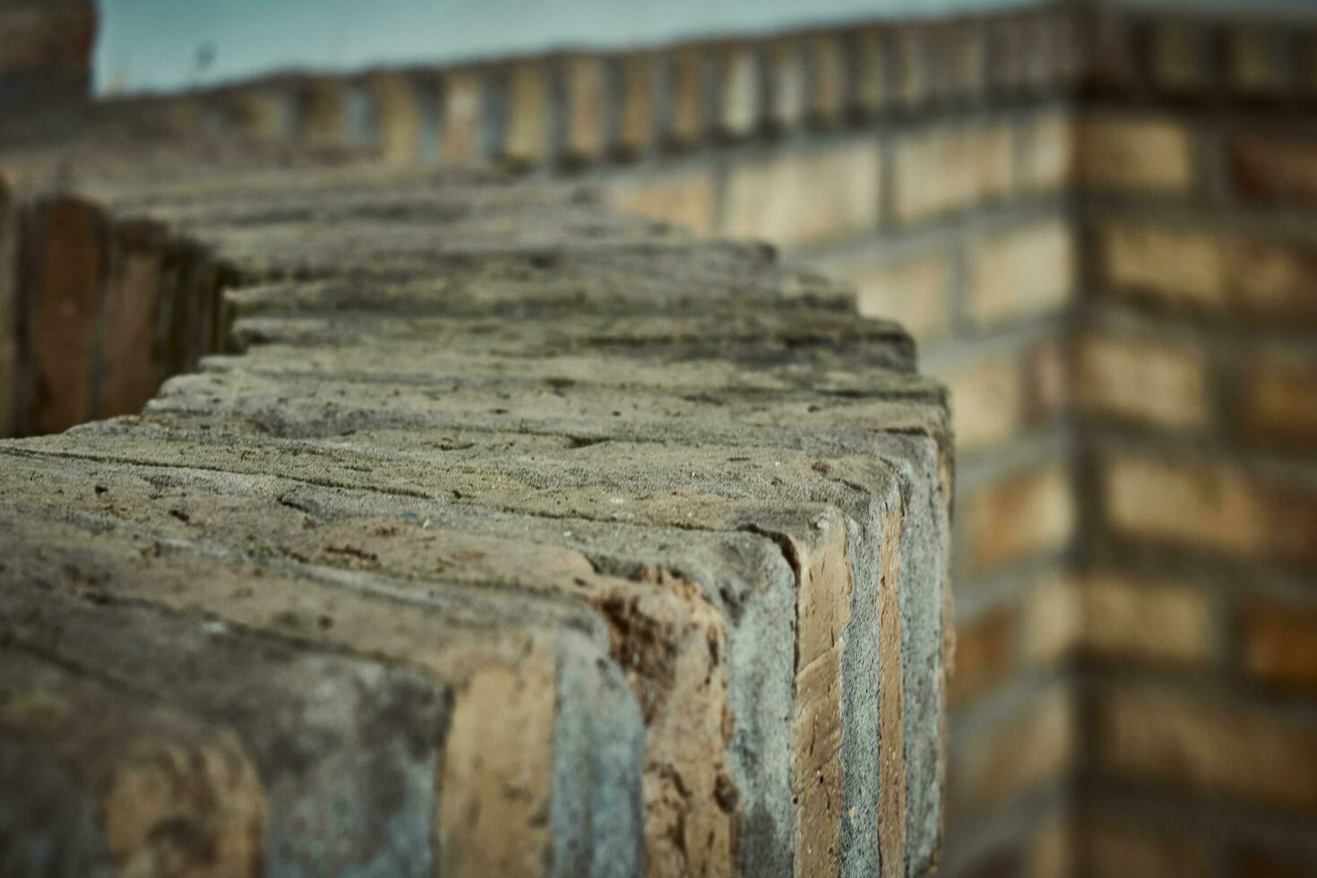 Brick well and corner with a nice bokeh. Rustic charm and blurred elegance photo