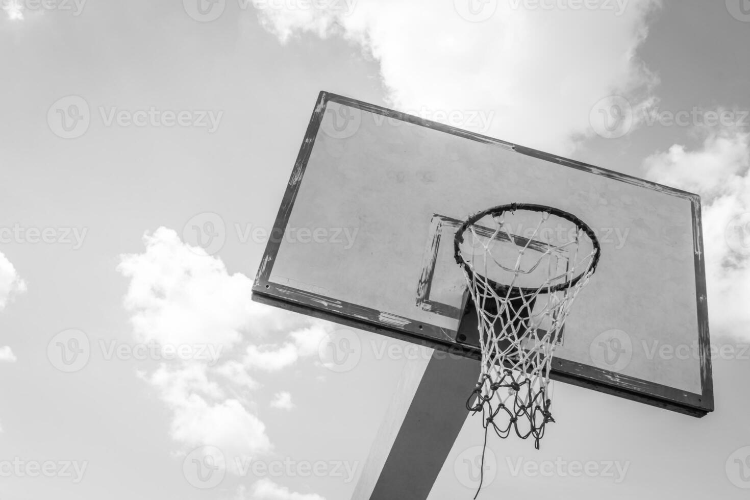 Basketball hoop on blue sky photo