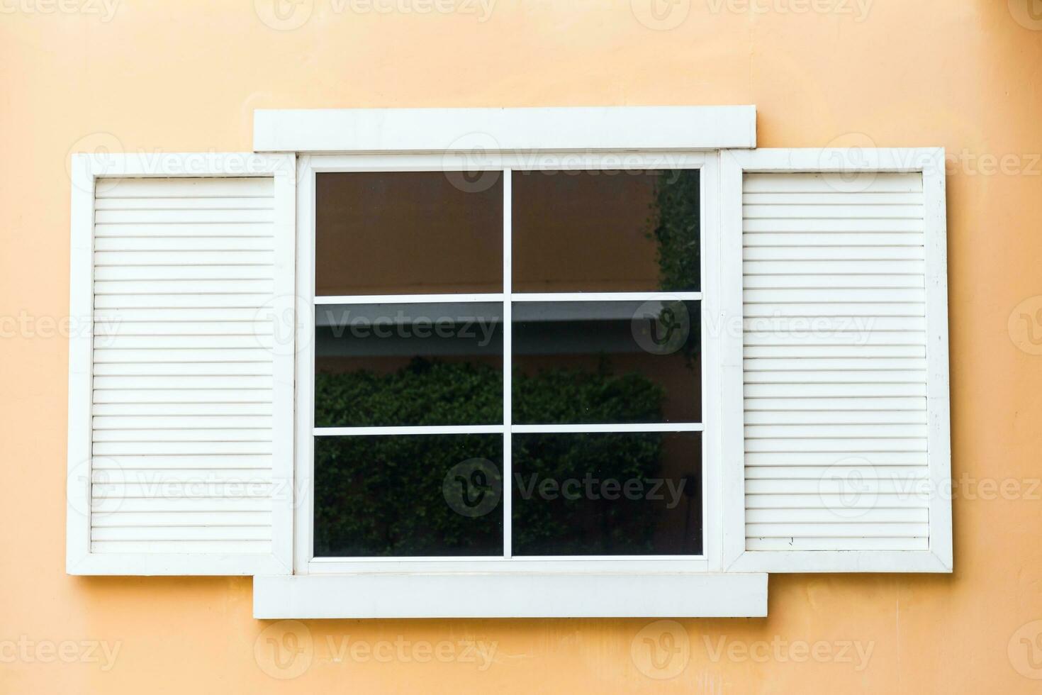 Vintage window on yellow cement photo