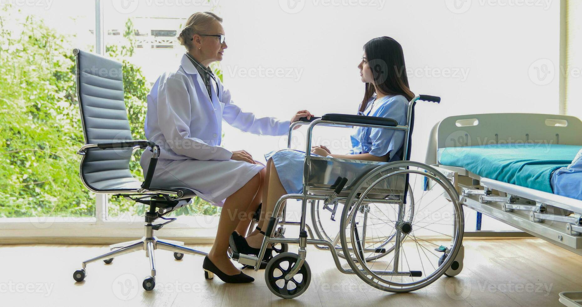 Asian woman patient sitting with doctor about her illness and showing x-ray results with blood pressure and heart rate measurement with stethoscope photo