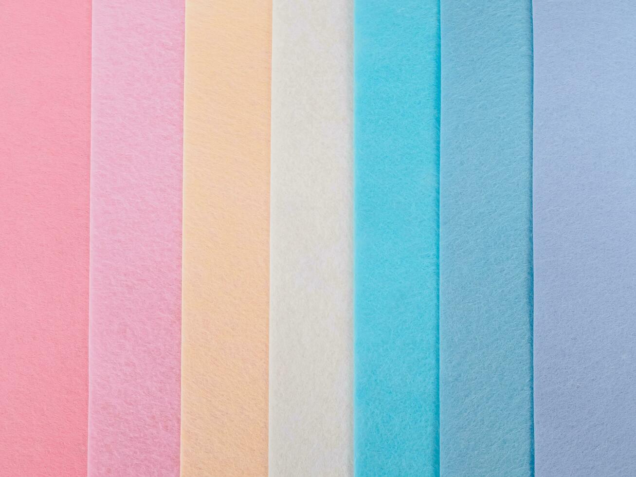 Pastel background, A stack of colorful fabric.Full frame shot of muti colored fabric background photo