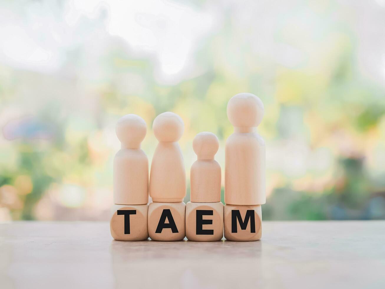 Wooden business figure standing on wooden block with word the TEAM for teamwork power and confidnce, Successful team leader concept. photo