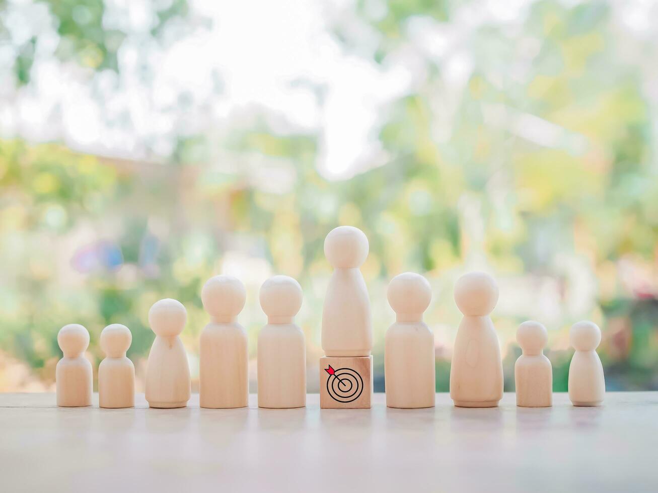 Wooden human figure standing on wooden block with  business strategy icons, Action plan and business process management concept. photo