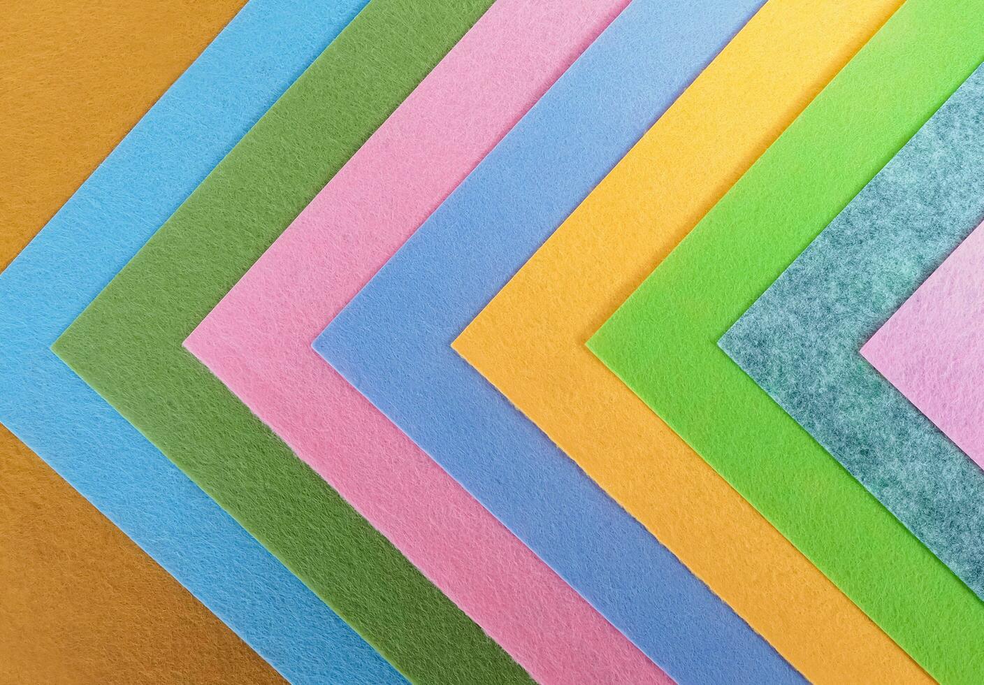 Pastel background, A stack of colorful fabric.Full frame shot of muti colored fabric background photo