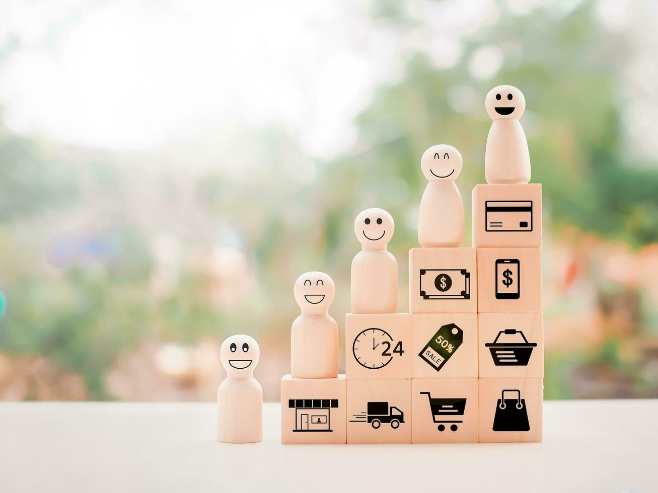 Wooden human figure and wooden block with online shopping and e-commerce icons set. photo