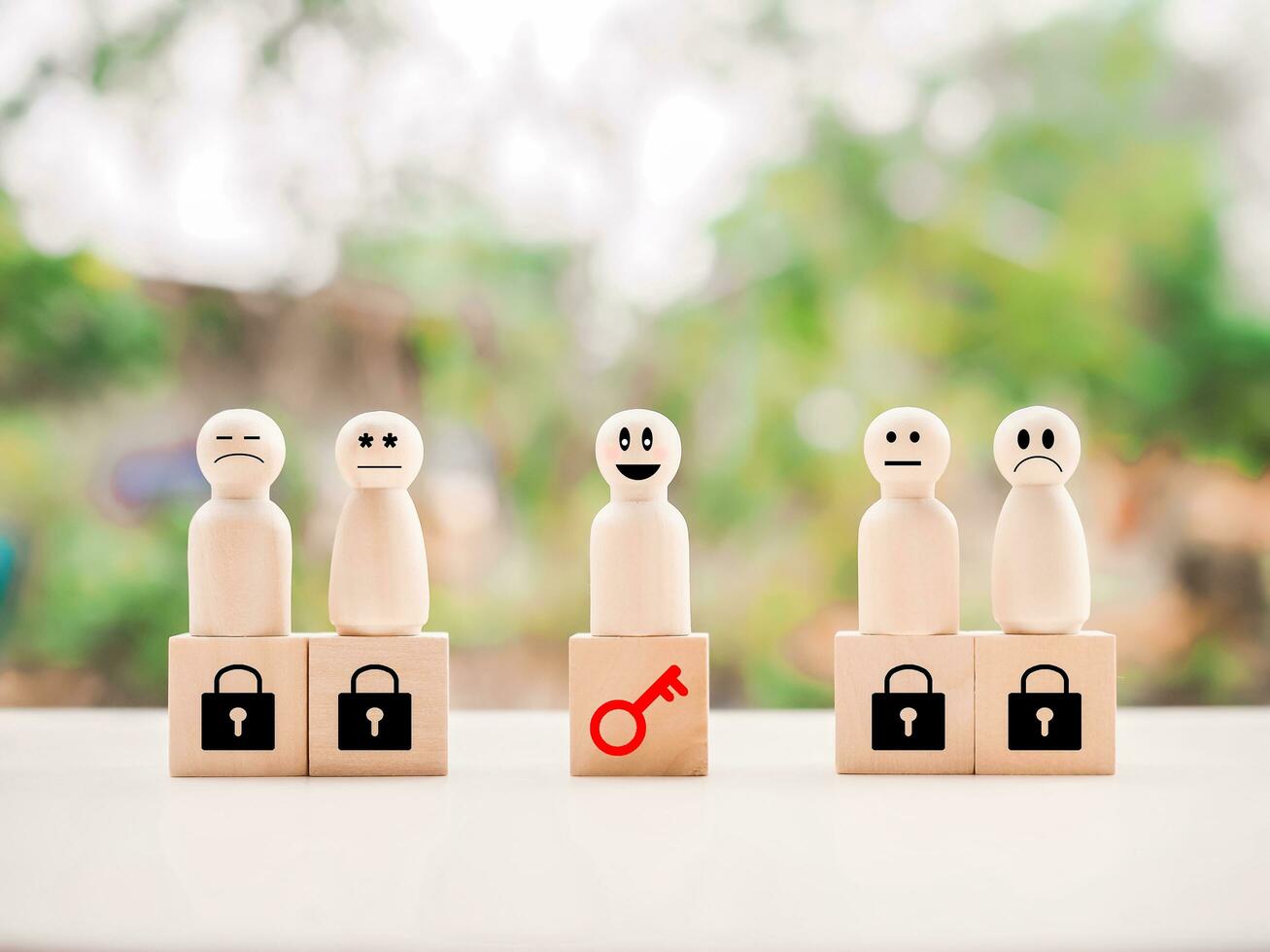 Wooden figure standing on wooden block of key and padlock. Key for finding solutions concept, business problem solving. Keys unlocking to achieve goals and mission. photo