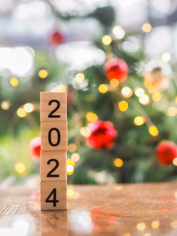 Close up of number 2024 with Christmas light bokeh background. Merry