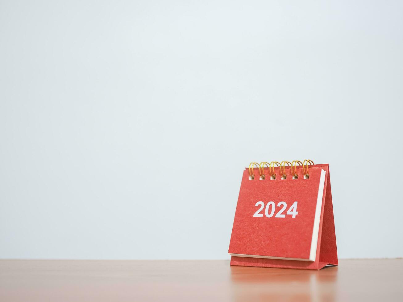 Close up 2024 desk calendar on the table with copy space. Resolution, Goal, Action, Planning, and manage to success business. photo
