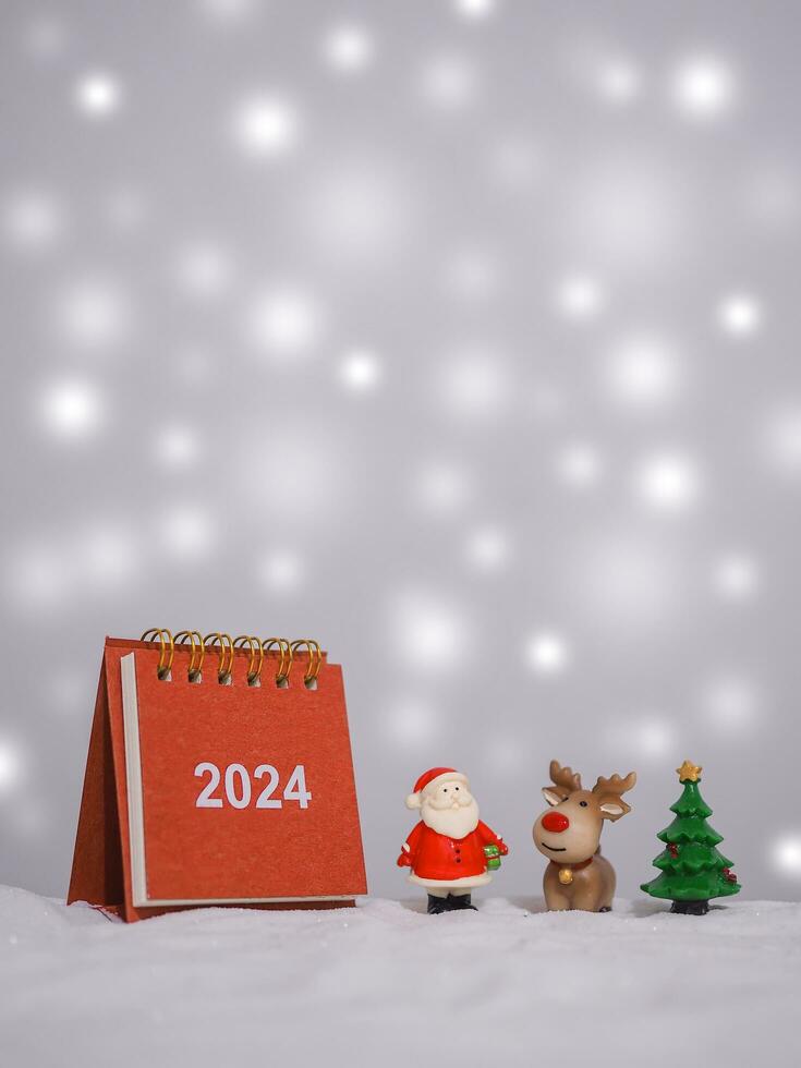 Close up calendar and christmas decoration with shiny light for New Year and Christmas 2024 concept. photo