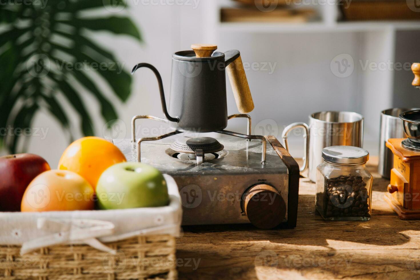 Happy young adult couple making breakfast and drinking coffee together in cozy home kitchen in morning at home. Preparing meal and smiling. Lifestyle, leisure and Love concept. photo