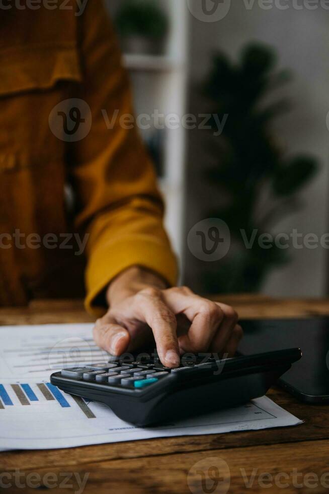 Business Man Financial Inspector and Secretary Making Report, Calculating or Checking Balance. Internal Revenue Service Inspector Checking Document Audit Concept photo