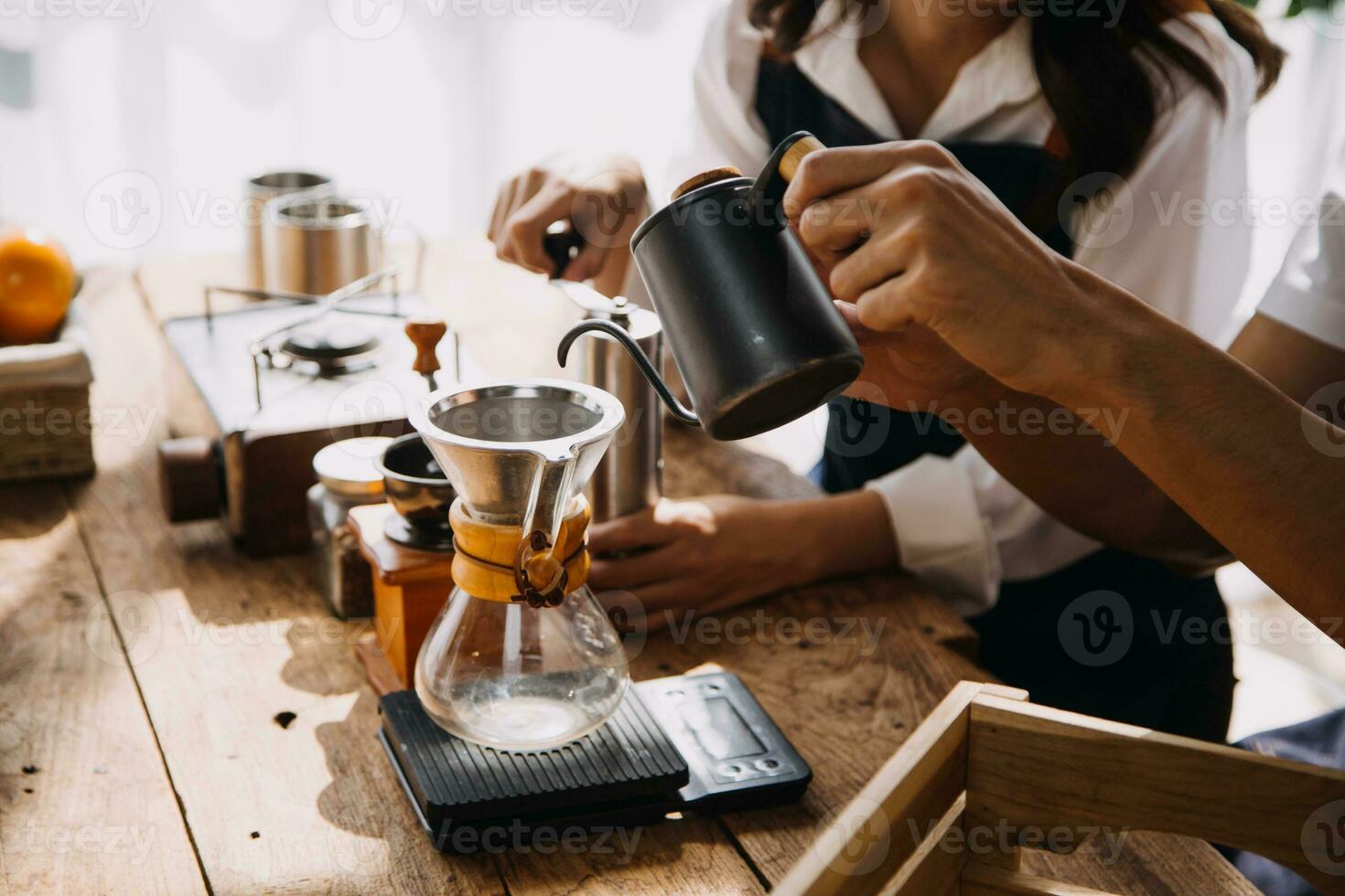 Happy young adult couple making breakfast and drinking coffee together in cozy home kitchen in morning at home. Preparing meal and smiling. Lifestyle, leisure and Love concept. photo