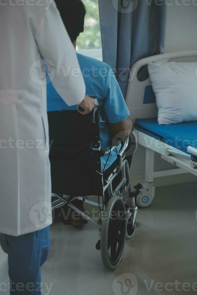 Depressed senior man sitting on the hospital bed alone at night, he feels lonely and abandoned photo