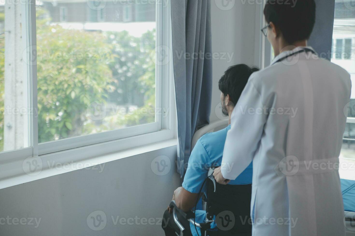 Depressed senior man sitting on the hospital bed alone at night, he feels lonely and abandoned photo