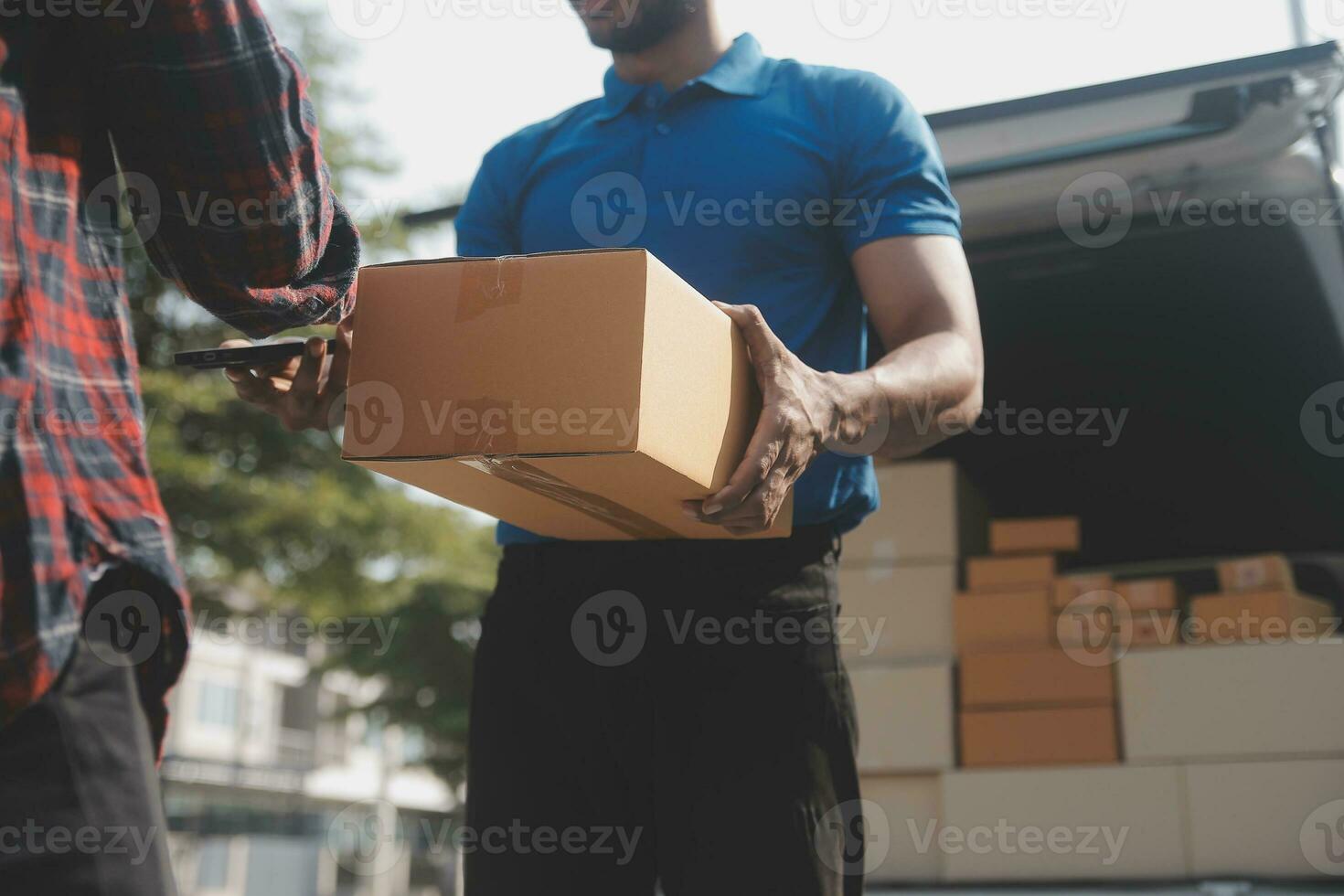 Young woman small business owner online shopping at home. taking note of orders from customers with mobile phones. SME entrepreneur or freelance life style concept. photo