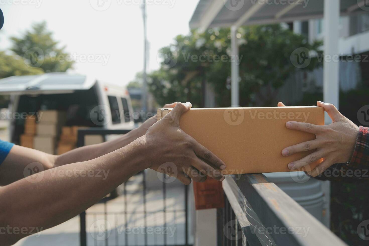 Young woman small business owner online shopping at home. taking note of orders from customers with mobile phones. SME entrepreneur or freelance life style concept. photo
