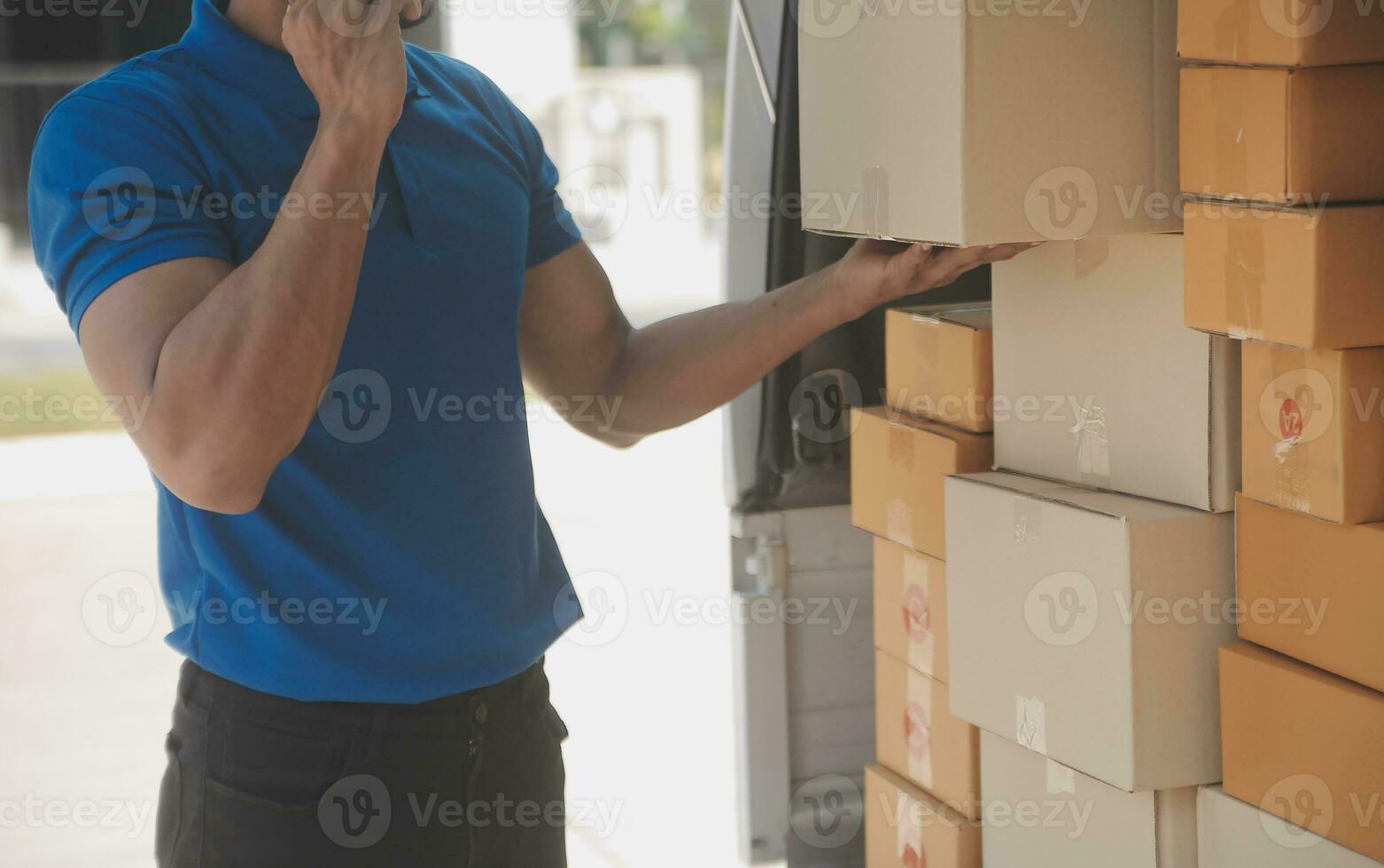 Young woman small business owner online shopping at home. taking note of orders from customers with mobile phones. SME entrepreneur or freelance life style concept. photo