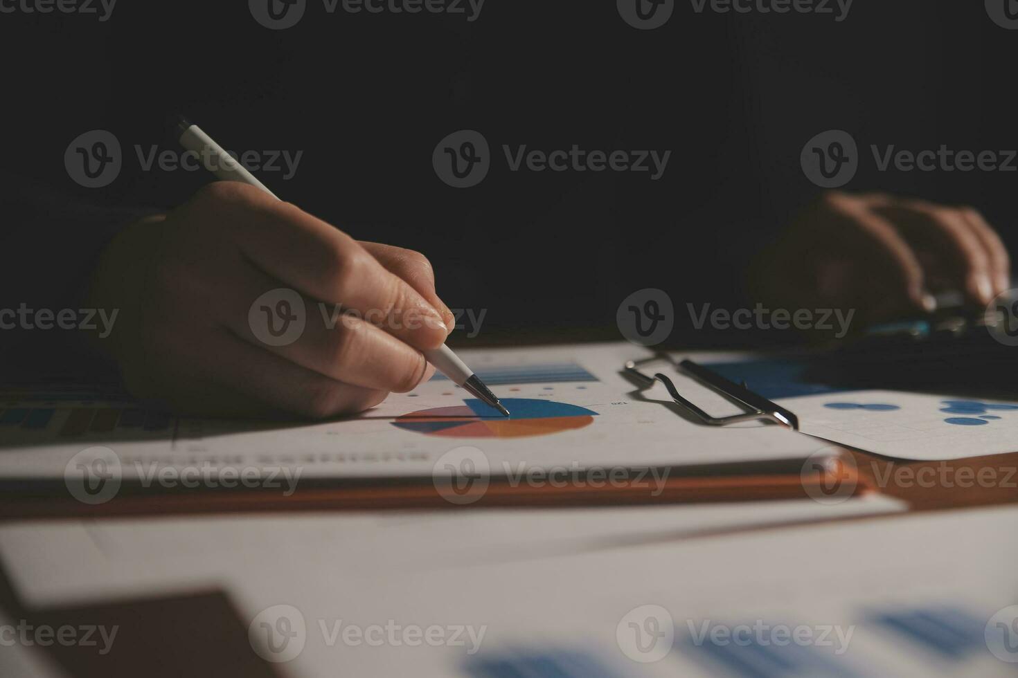 Close up businessman hand using calculator and working with laptop calculate about finance accounting at coffeeshop outdor.finance accounting concept photo