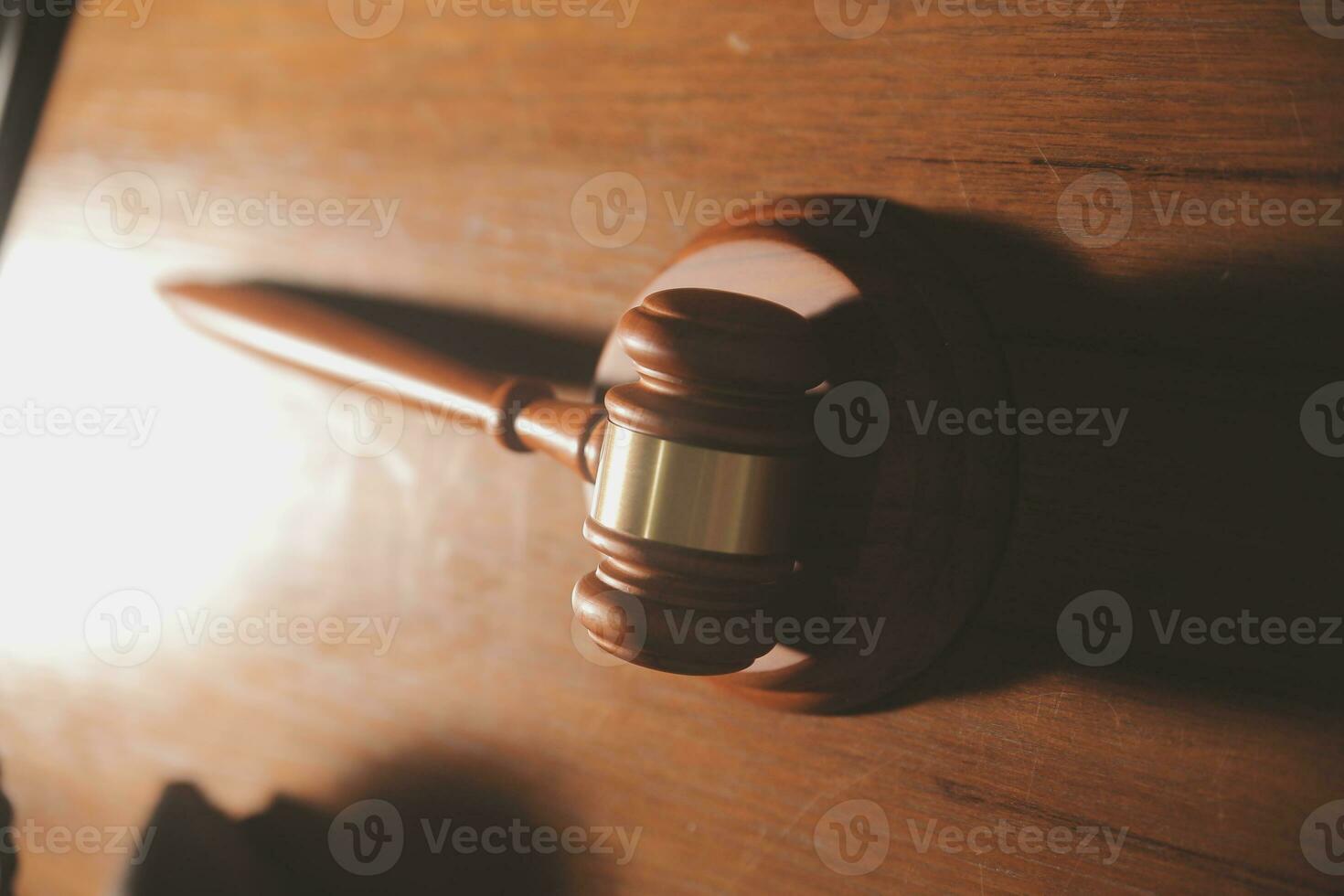 Business and lawyers discussing contract papers with brass scale on desk in office. Law, legal services, advice, justice and law concept picture with film grain effect photo