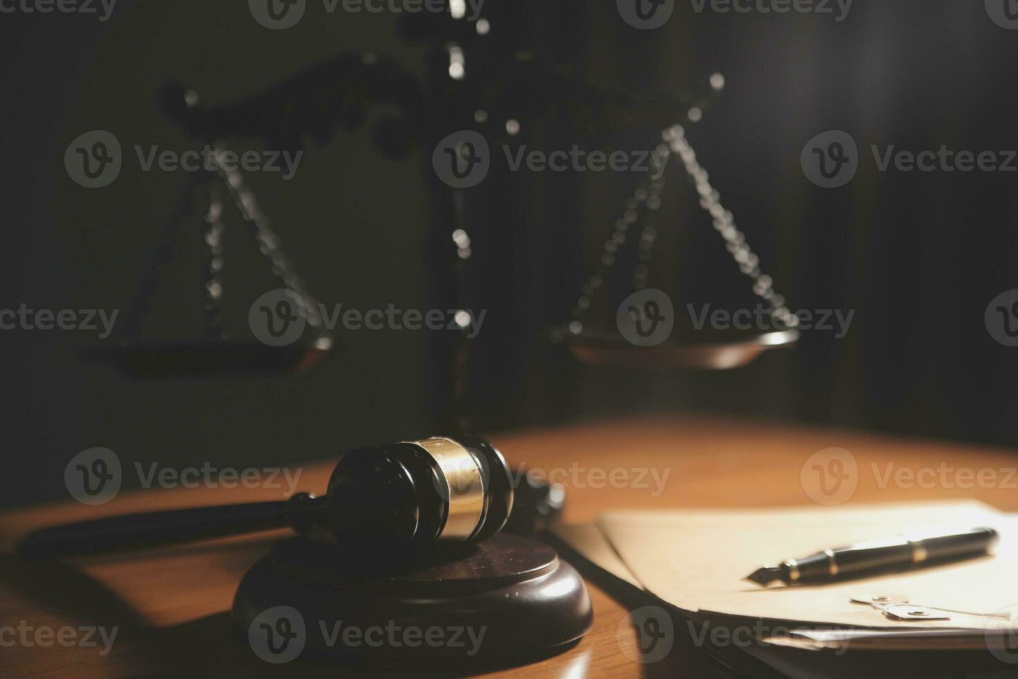 Business and lawyers discussing contract papers with brass scale on desk in office. Law, legal services, advice, justice and law concept picture with film grain effect photo