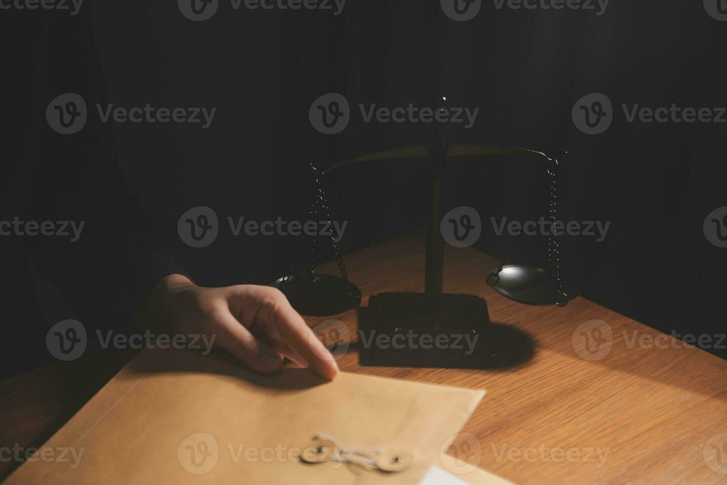 Business and lawyers discussing contract papers with brass scale on desk in office. Law, legal services, advice, justice and law concept picture with film grain effect photo