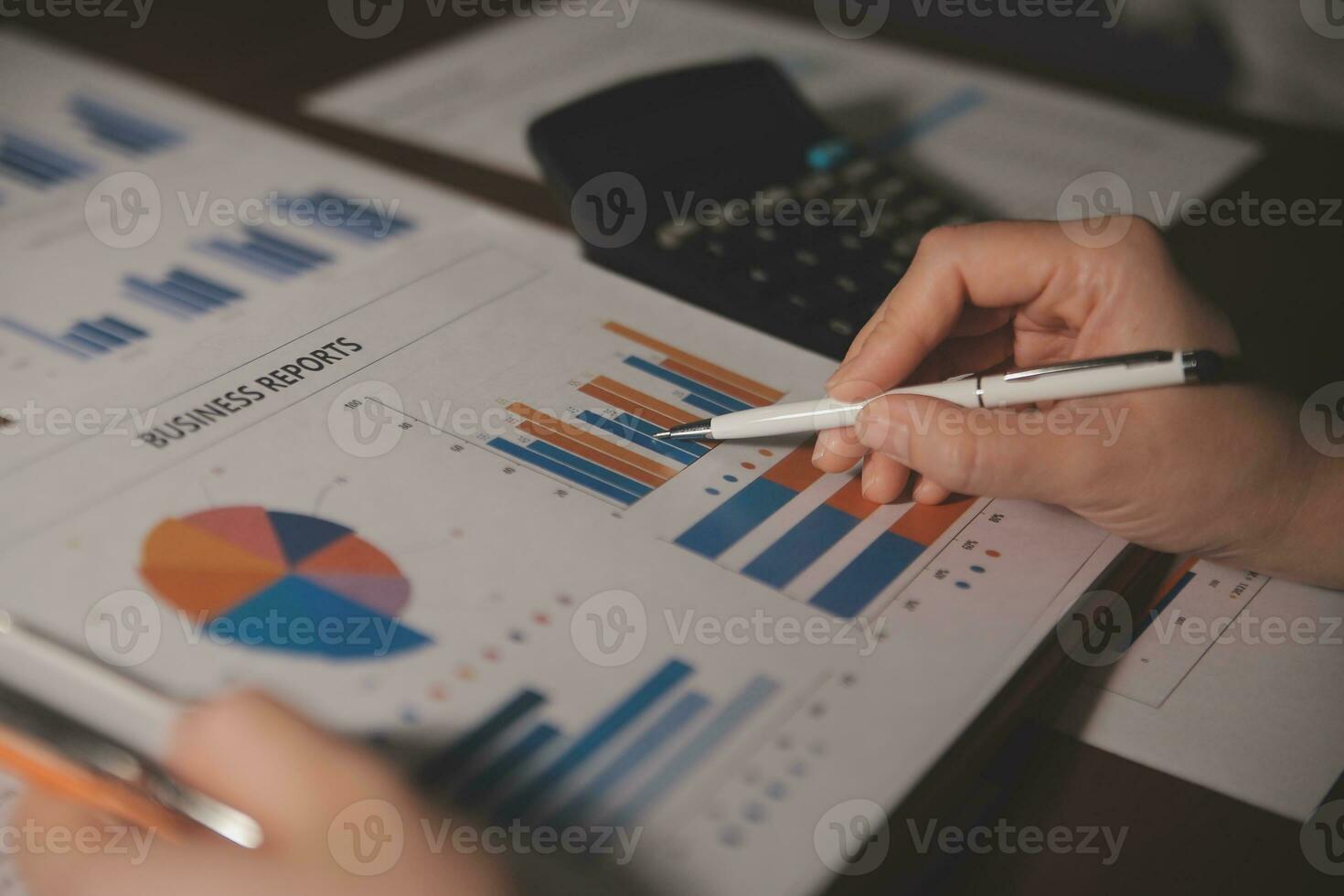Close up businessman hand using calculator and working with laptop calculate about finance accounting at coffeeshop outdor.finance accounting concept photo