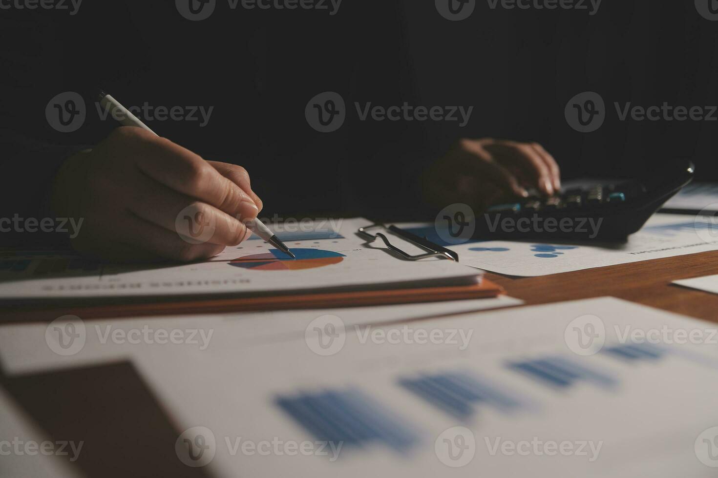 Close up businessman hand using calculator and working with laptop calculate about finance accounting at coffeeshop outdor.finance accounting concept photo