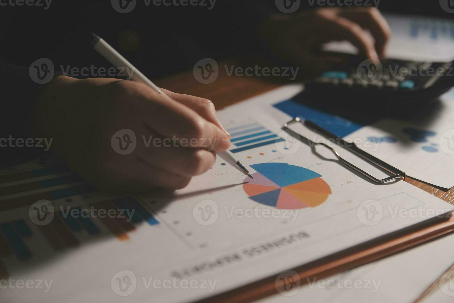 Close up businessman hand using calculator and working with laptop calculate about finance accounting at coffeeshop outdor.finance accounting concept photo