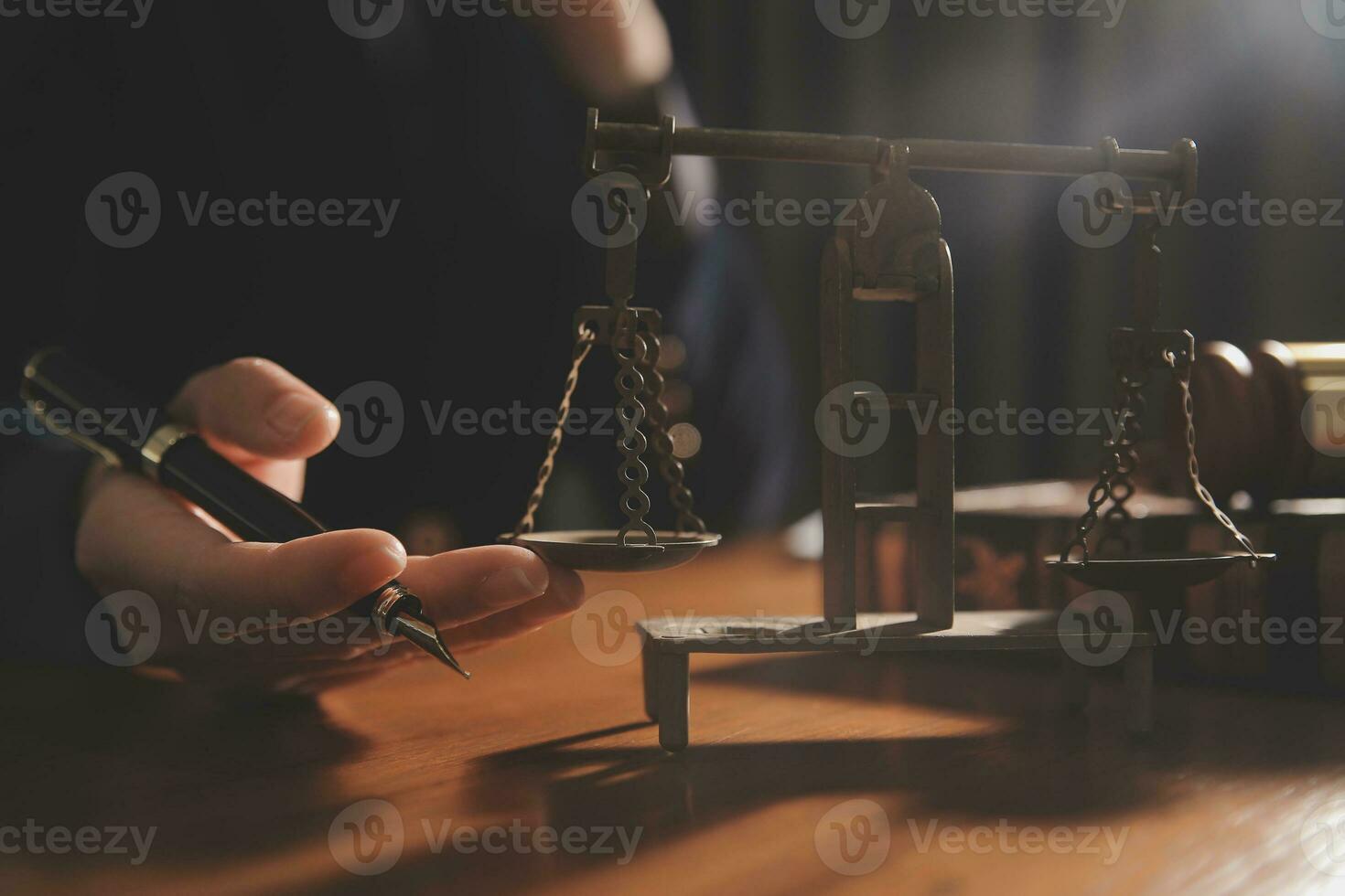 Business and lawyers discussing contract papers with brass scale on desk in office. Law, legal services, advice, justice and law concept picture with film grain effect photo