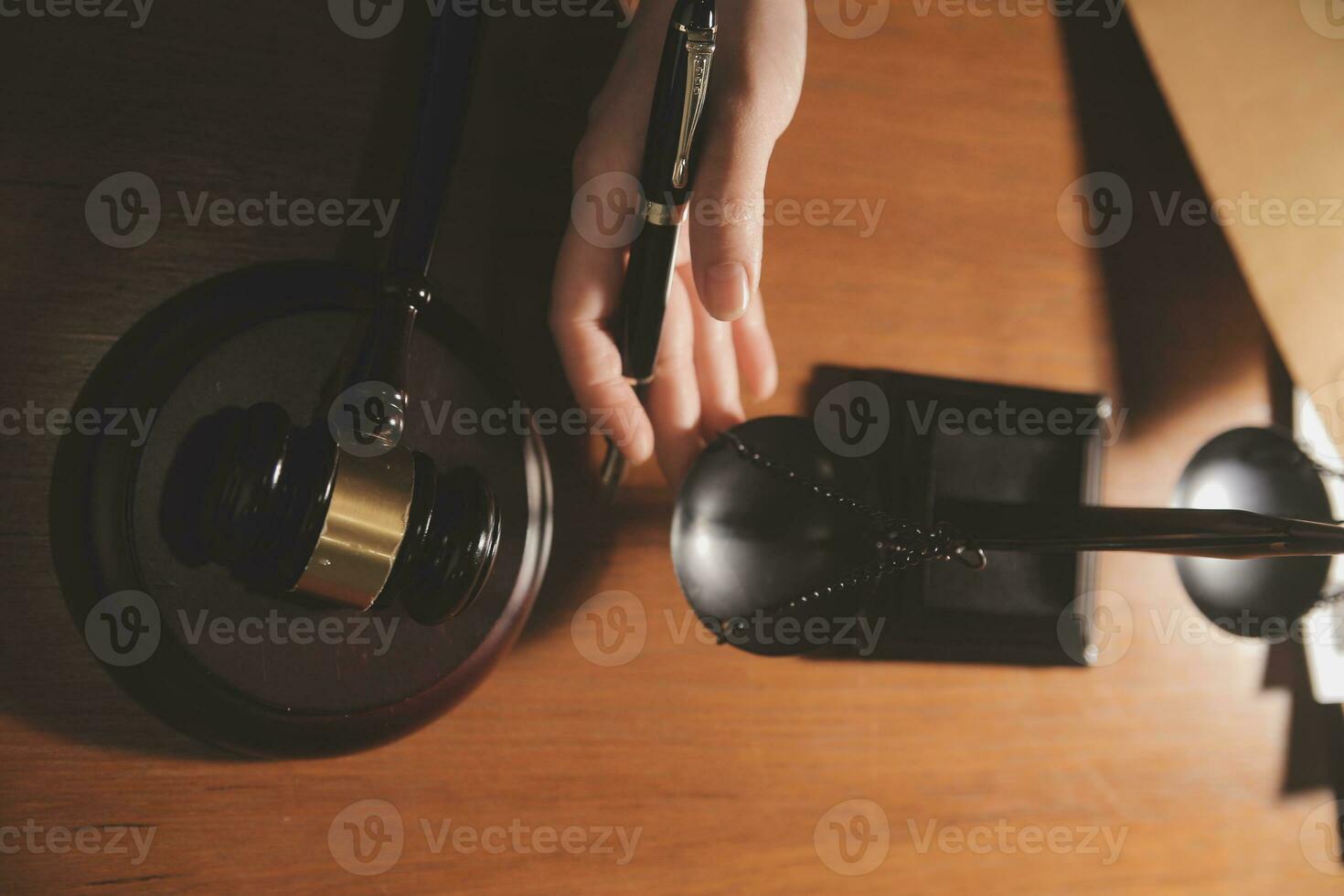 Business and lawyers discussing contract papers with brass scale on desk in office. Law, legal services, advice, justice and law concept picture with film grain effect photo