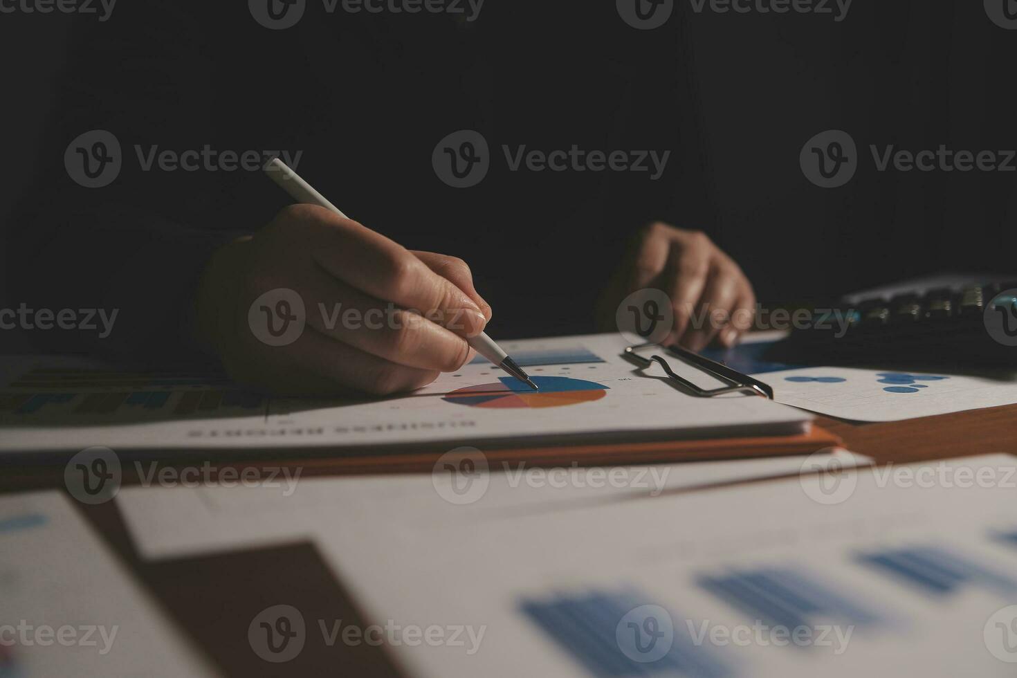 Close up businessman hand using calculator and working with laptop calculate about finance accounting at coffeeshop outdor.finance accounting concept photo