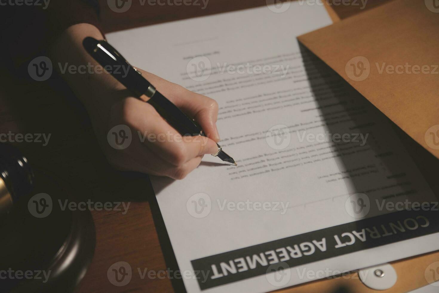 Business and lawyers discussing contract papers with brass scale on desk in office. Law, legal services, advice, justice and law concept picture with film grain effect photo