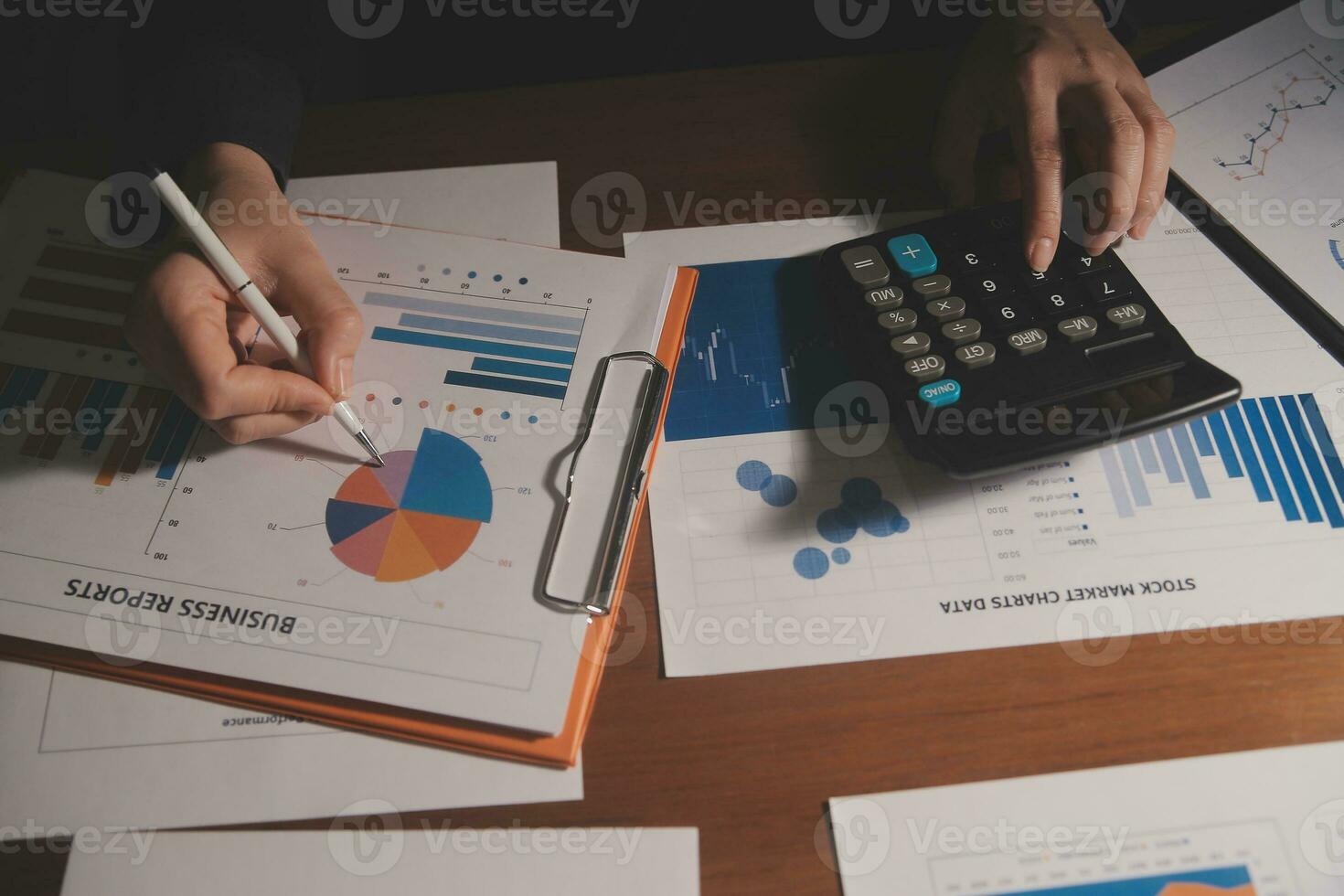 Close up businessman hand using calculator and working with laptop calculate about finance accounting at coffeeshop outdor.finance accounting concept photo