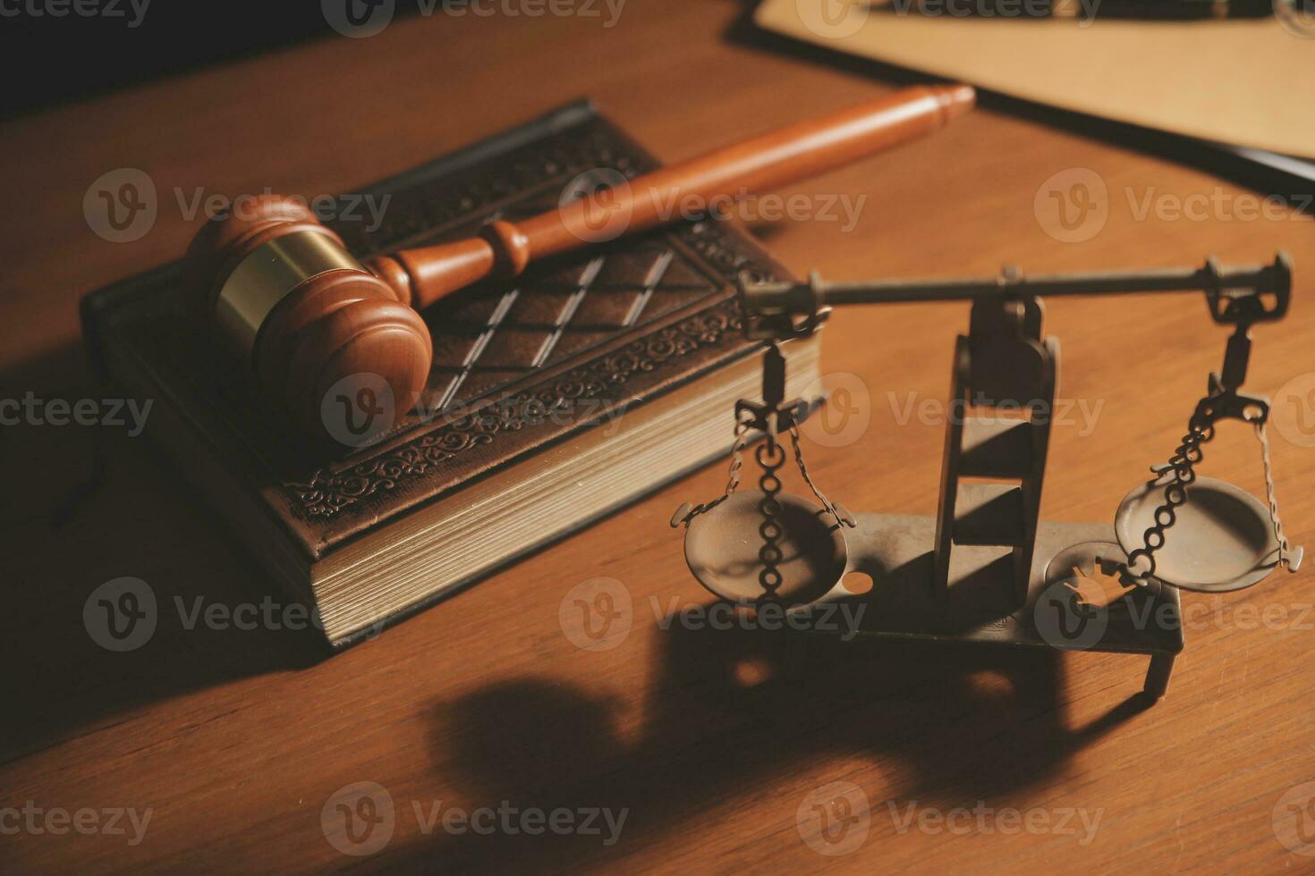Business and lawyers discussing contract papers with brass scale on desk in office. Law, legal services, advice, justice and law concept picture with film grain effect photo