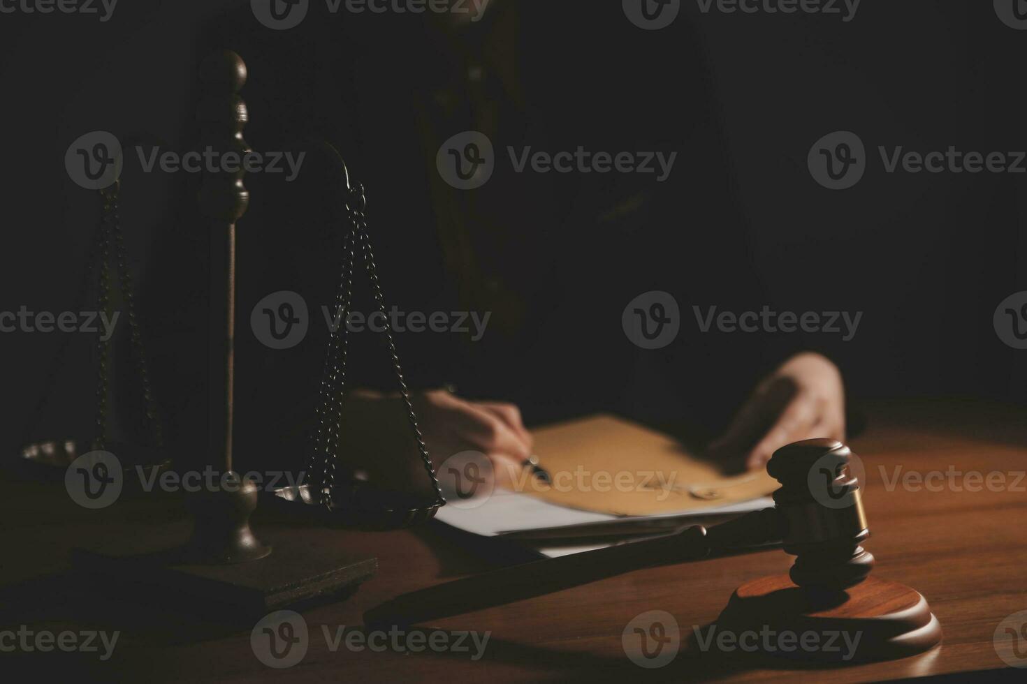 Business and lawyers discussing contract papers with brass scale on desk in office. Law, legal services, advice, justice and law concept picture with film grain effect photo