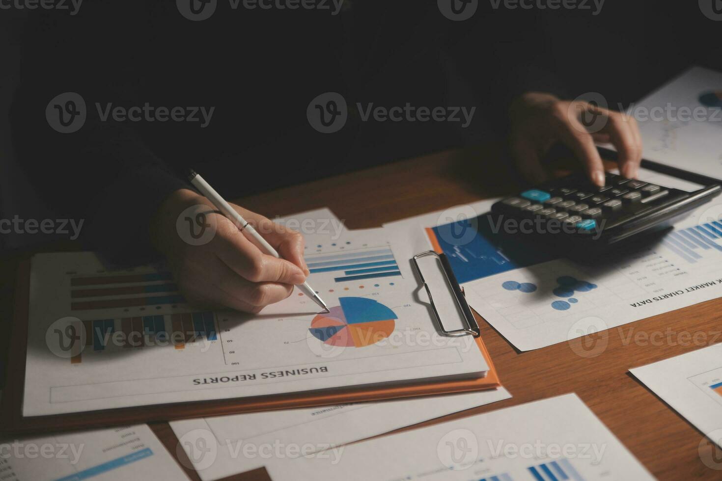 Close up businessman hand using calculator and working with laptop calculate about finance accounting at coffeeshop outdor.finance accounting concept photo