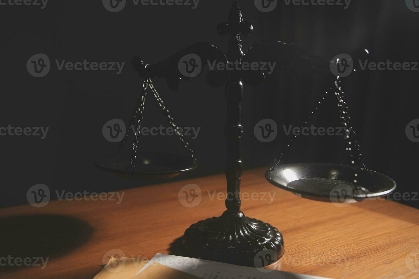 Business and lawyers discussing contract papers with brass scale on desk in office. Law, legal services, advice, justice and law concept picture with film grain effect photo