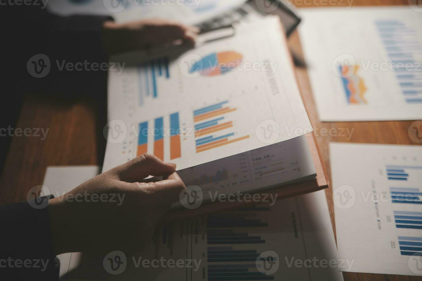 Close up businessman hand using calculator and working with laptop calculate about finance accounting at coffeeshop outdor.finance accounting concept photo