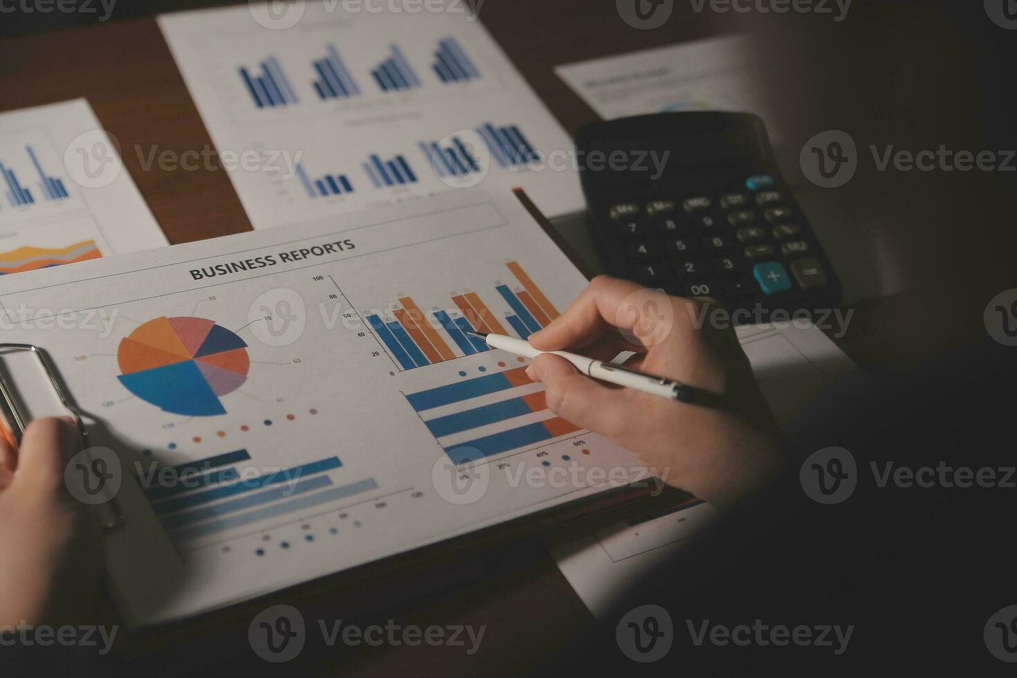 Close up businessman hand using calculator and working with laptop calculate about finance accounting at coffeeshop outdor.finance accounting concept photo