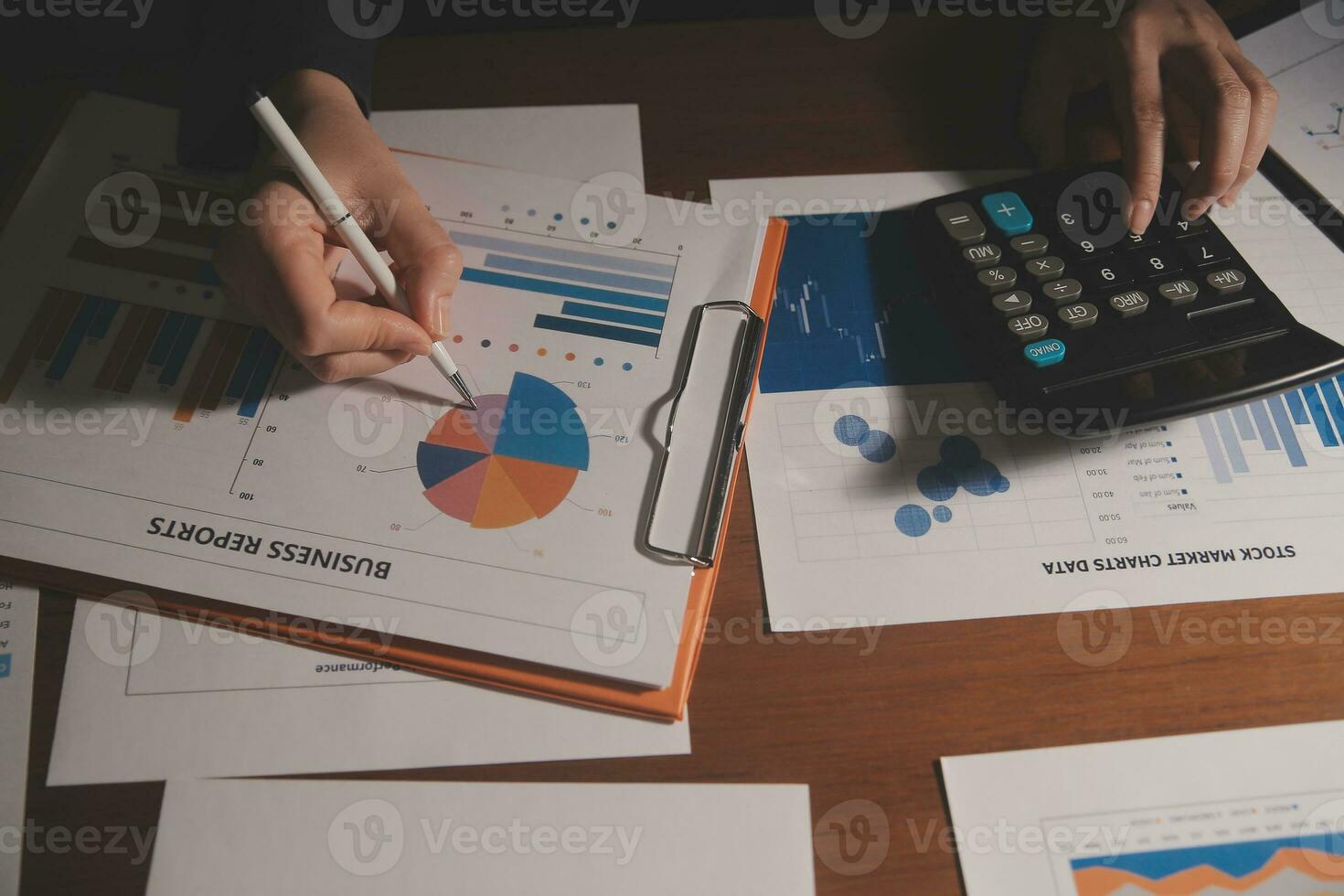 Close up businessman hand using calculator and working with laptop calculate about finance accounting at coffeeshop outdor.finance accounting concept photo
