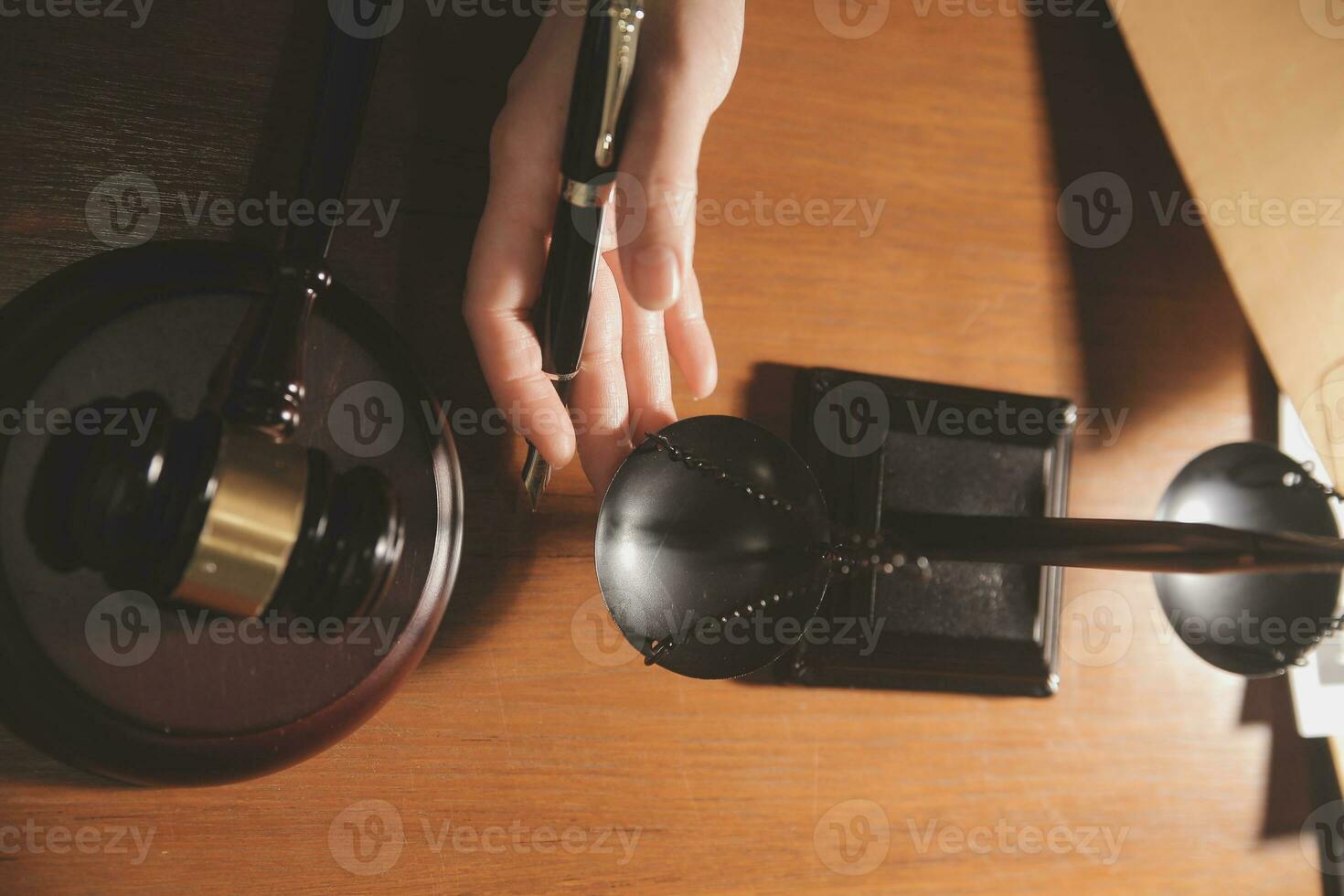 Business and lawyers discussing contract papers with brass scale on desk in office. Law, legal services, advice, justice and law concept picture with film grain effect photo