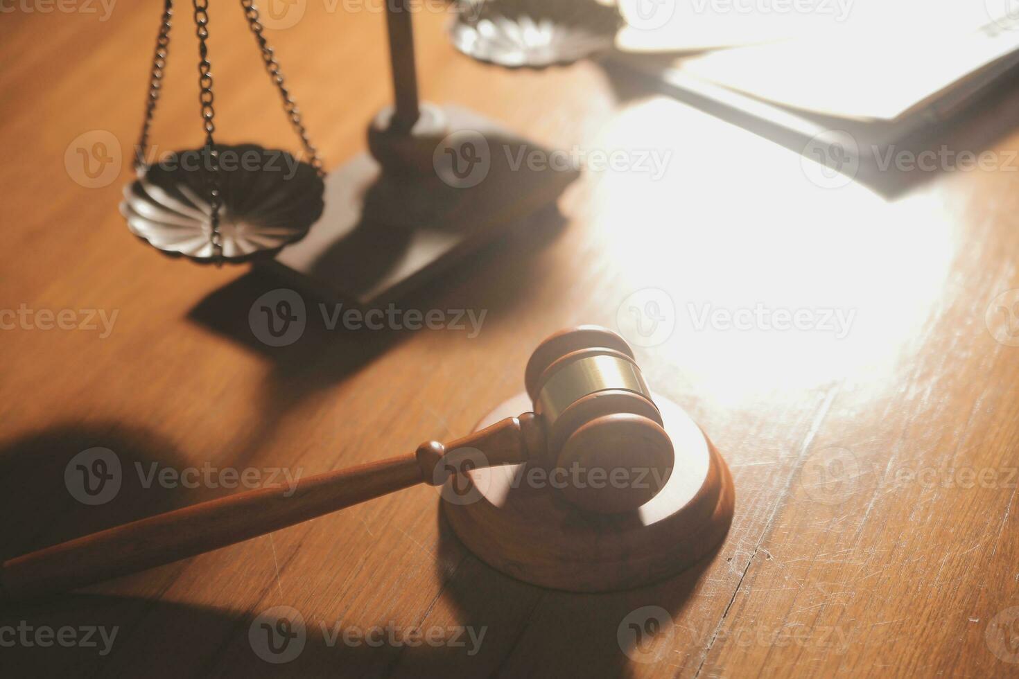 Business and lawyers discussing contract papers with brass scale on desk in office. Law, legal services, advice, justice and law concept picture with film grain effect photo