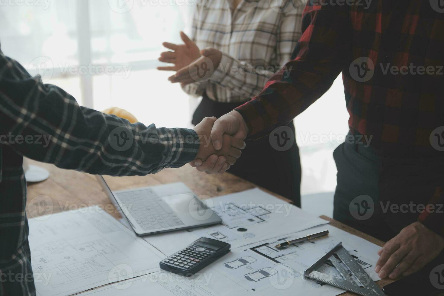 Construction and structure concept of engineer working drawing on blueprint meeting for project working with partner on model building and engineering tools in working site, construction concept. photo