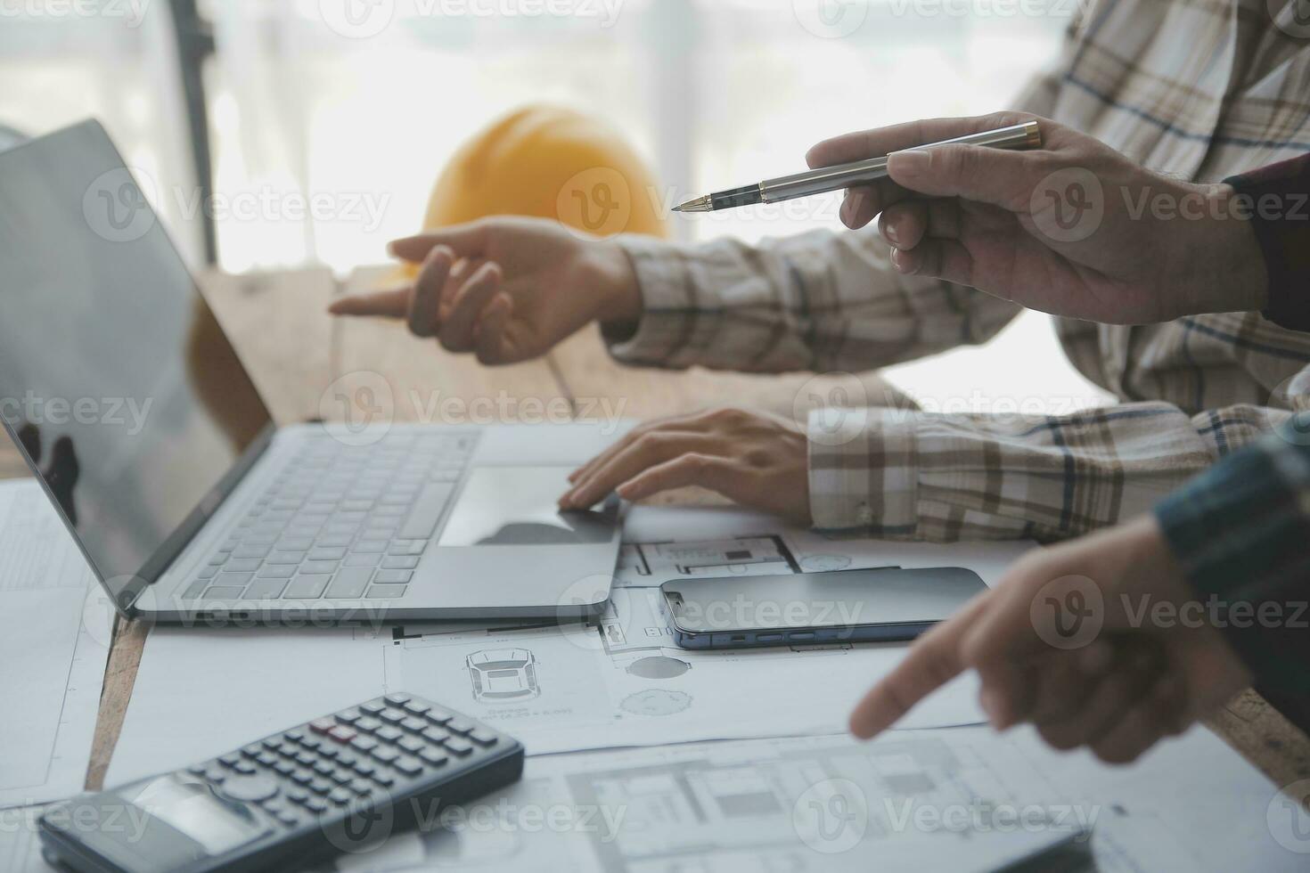 Construction and structure concept of engineer working drawing on blueprint meeting for project working with partner on model building and engineering tools in working site, construction concept. photo