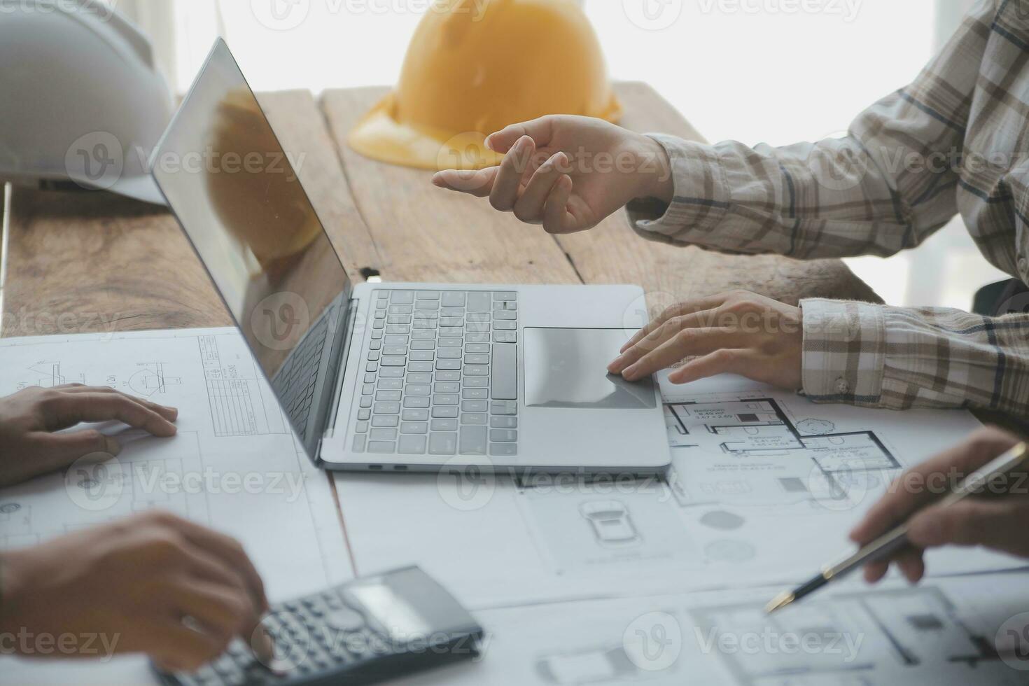 Construction and structure concept of engineer working drawing on blueprint meeting for project working with partner on model building and engineering tools in working site, construction concept. photo