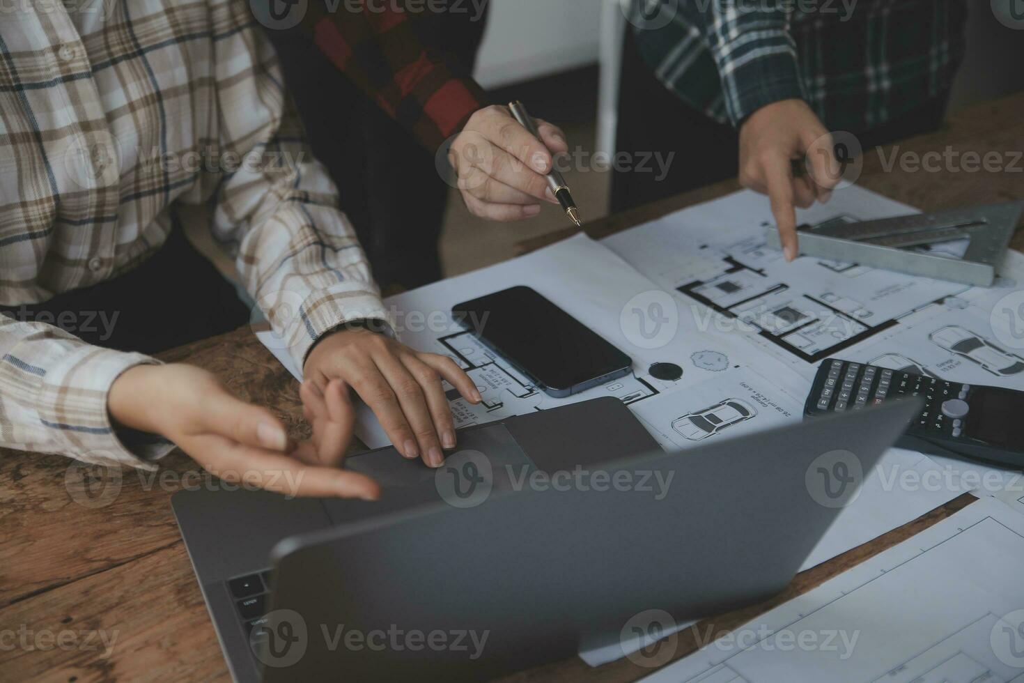 Construction and structure concept of engineer working drawing on blueprint meeting for project working with partner on model building and engineering tools in working site, construction concept. photo