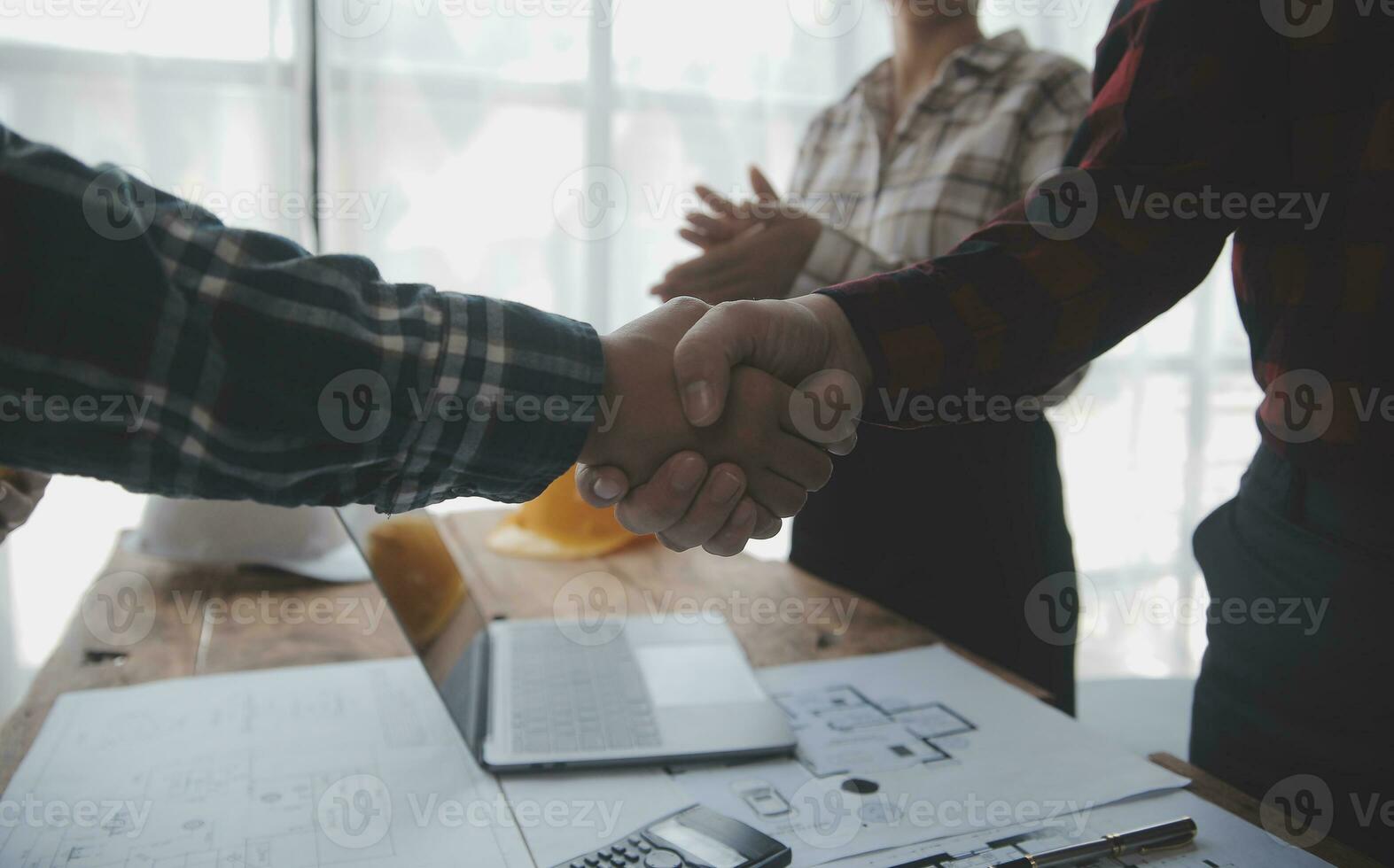Construction and structure concept of engineer working drawing on blueprint meeting for project working with partner on model building and engineering tools in working site, construction concept. photo
