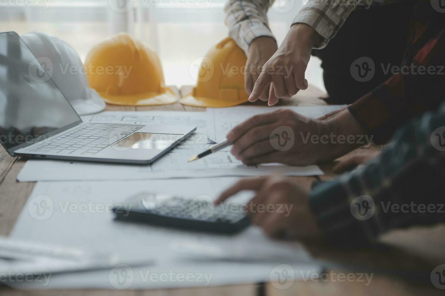 Engineer Teamwork Meeting, Drawing working on blueprint meeting for project working with partner on model building and engineering tools in working site, Construction and structure concept. photo