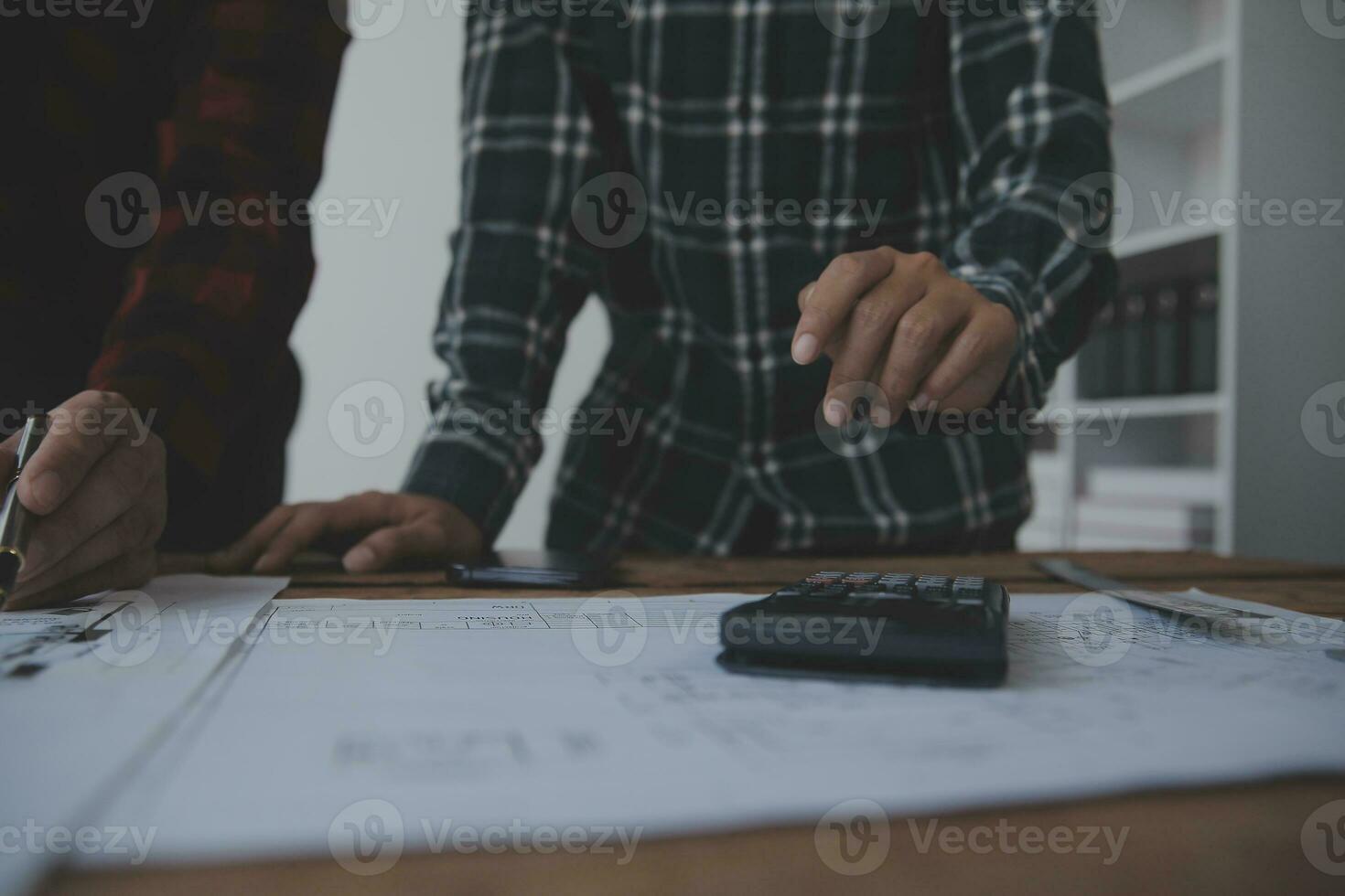 Engineer Teamwork Meeting, Drawing working on blueprint meeting for project working with partner on model building and engineering tools in working site, Construction and structure concept. photo